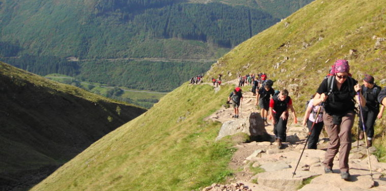 A group of tourists hiking in a mountain area